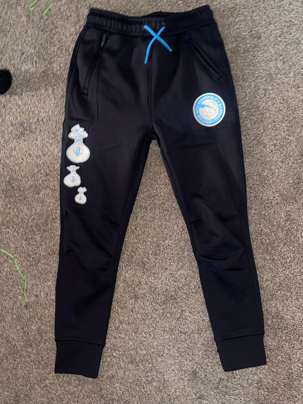 Kids Black Athletic Bottoms with Blue Badge Details